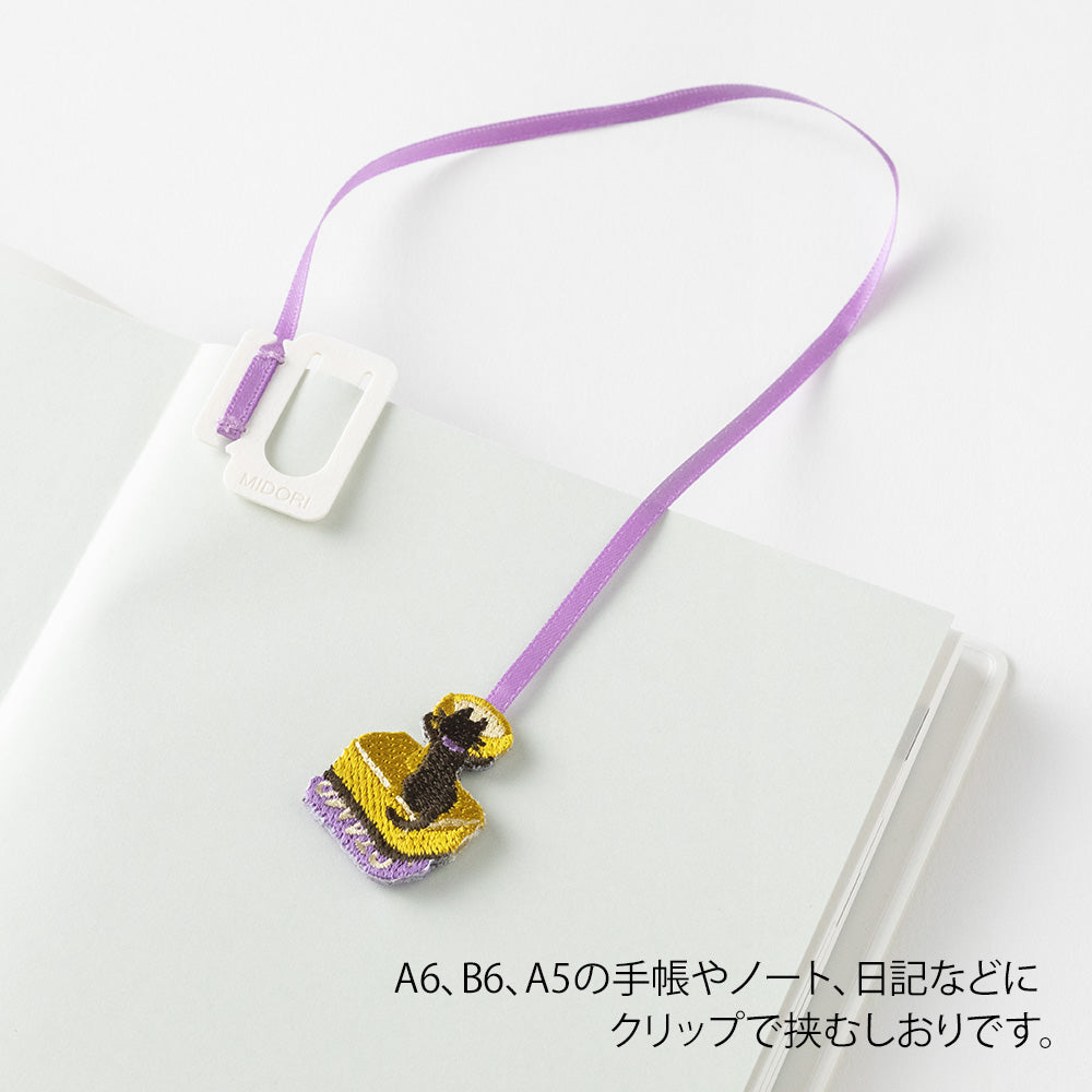 marque-page-clips-chat-magicien vue 3